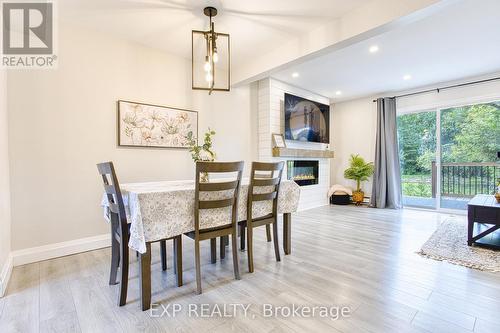 16 - 125 Livingston Avenue, Grimsby, ON - Indoor Photo Showing Dining Room With Fireplace