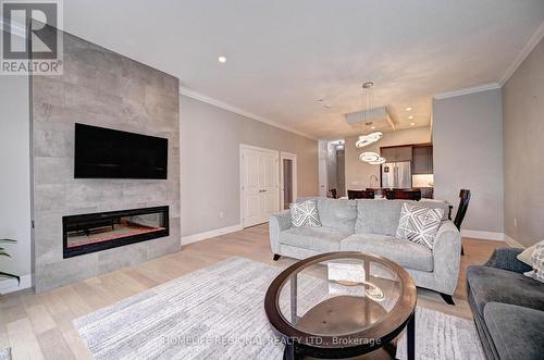 114 - 1880 Gordon Street S, Guelph, ON - Indoor Photo Showing Living Room With Fireplace