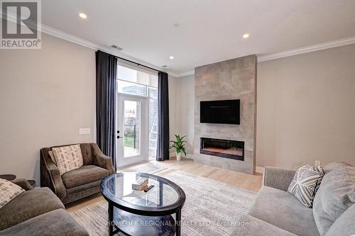 114 - 1880 Gordon Street S, Guelph, ON - Indoor Photo Showing Living Room With Fireplace