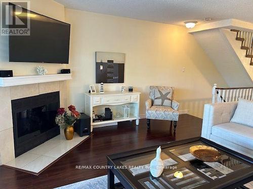 6 - 30 Laguna Parkway, Ramara, ON - Indoor Photo Showing Living Room With Fireplace