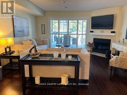 6 - 30 Laguna Parkway, Ramara, ON - Indoor Photo Showing Living Room With Fireplace