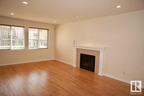 3855 Agar Green Gr Sw, Edmonton, AB - Indoor Photo Showing Other Room With Fireplace