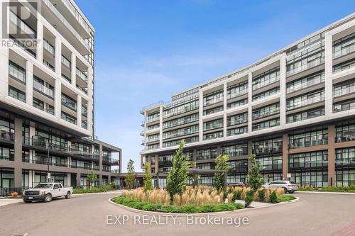 327 - 50 George Butchart Drive, Toronto, ON - Outdoor With Balcony With Facade