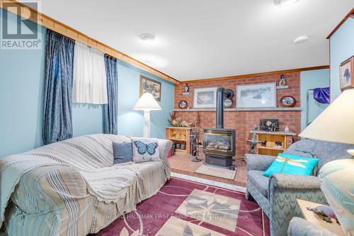 52 Charles Road, Tweed, ON - Indoor Photo Showing Other Room With Fireplace