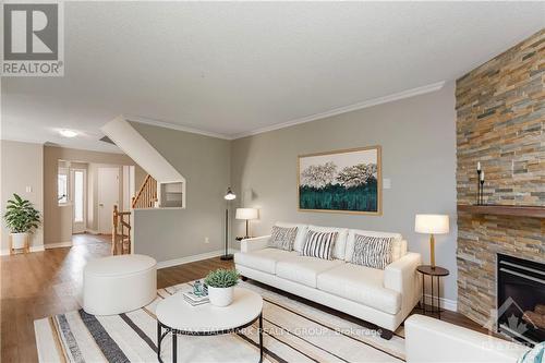 859 Nesting Way, Ottawa, ON - Indoor Photo Showing Living Room With Fireplace