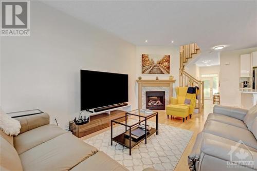 204 Espin Heights, Ottawa, ON - Indoor Photo Showing Living Room With Fireplace