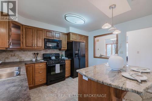 24307 Thomson Line, West Elgin (West Lorne), ON - Indoor Photo Showing Kitchen With Double Sink