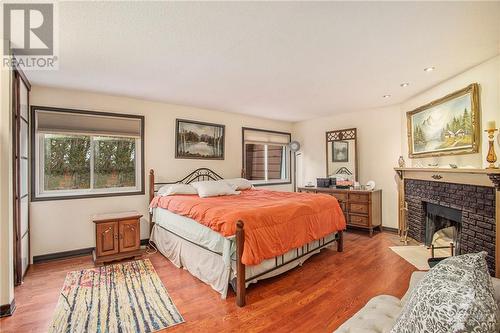 2545 Flannery Drive, Ottawa, ON - Indoor Photo Showing Bedroom With Fireplace