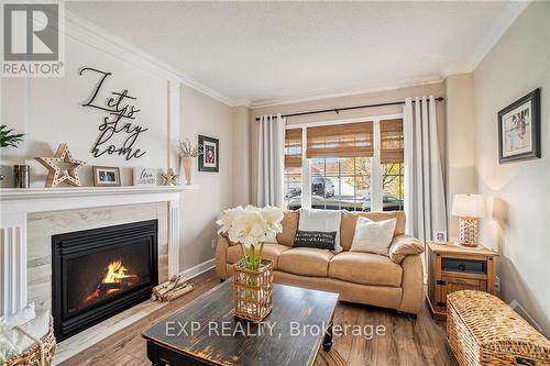 108 Lamadeleine Boulevard, Russell, ON - Indoor Photo Showing Living Room With Fireplace