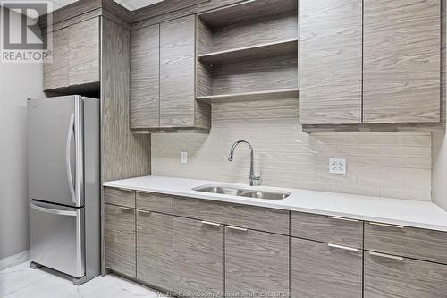 11870 Tecumseh Road East Unit# 605, Tecumseh, ON - Indoor Photo Showing Kitchen With Double Sink