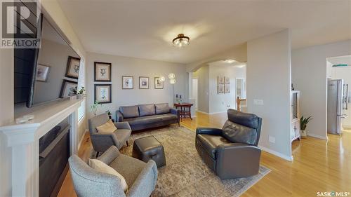 3360 Windsor Park Crescent, Regina, SK - Indoor Photo Showing Living Room With Fireplace