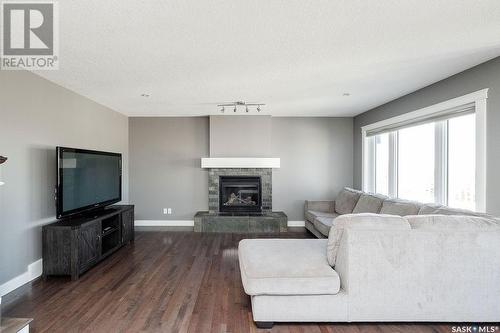 134 Herauf Street, Balgonie, SK - Indoor Photo Showing Living Room With Fireplace