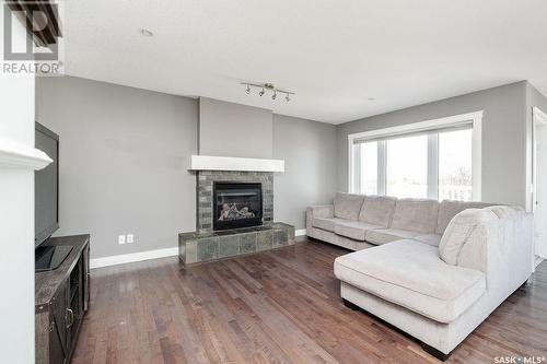 134 Herauf Street, Balgonie, SK - Indoor Photo Showing Living Room With Fireplace