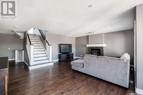 134 Herauf Street, Balgonie, SK - Indoor Photo Showing Living Room With Fireplace