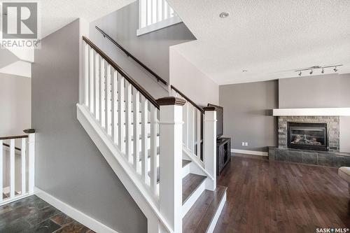 134 Herauf Street, Balgonie, SK - Indoor Photo Showing Other Room With Fireplace