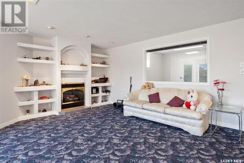 415 Braeside Bay, Saskatoon, SK - Indoor Photo Showing Living Room With Fireplace