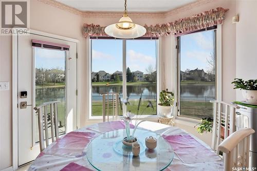 415 Braeside Bay, Saskatoon, SK - Indoor Photo Showing Dining Room With Body Of Water