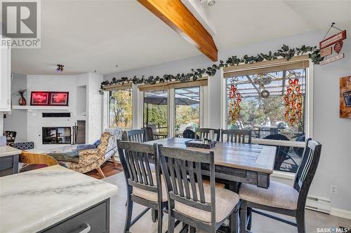 22 Chemin Bellevue Road, Battleford, SK - Indoor Photo Showing Dining Room With Fireplace