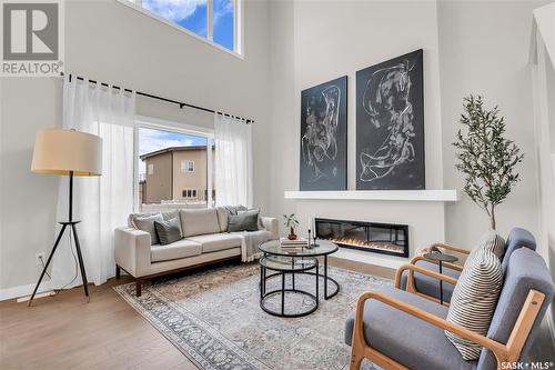 402 Aniskotaw Way, Saskatoon, SK - Indoor Photo Showing Living Room With Fireplace