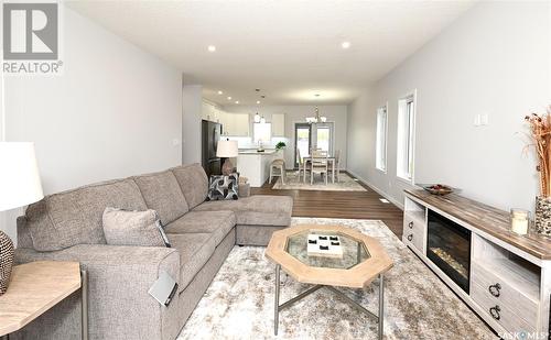 3 2330 Morsky Drive, Estevan, SK - Indoor Photo Showing Living Room With Fireplace