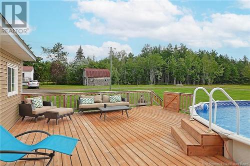 940 Pleasant Drive, Minto, NB - Outdoor With Above Ground Pool With Deck Patio Veranda With Backyard