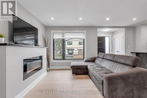 10 Bayside Avenue, Hamilton, ON - Indoor Photo Showing Living Room With Fireplace