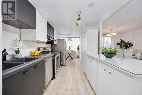 209 - 10 Markbrook Lane, Toronto, ON - Indoor Photo Showing Kitchen With Double Sink With Upgraded Kitchen