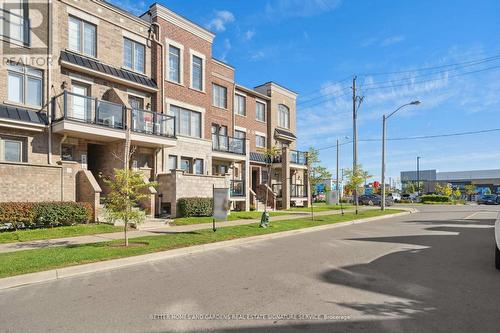 95 - 100 Parrotta Drive, Toronto, ON - Outdoor With Balcony With Facade