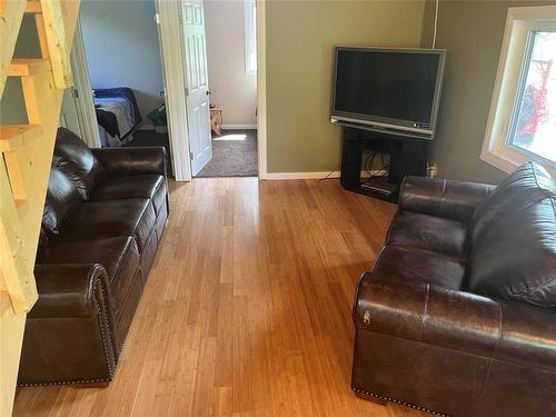 Swan River, Manitoba - Indoor Photo Showing Living Room With Fireplace