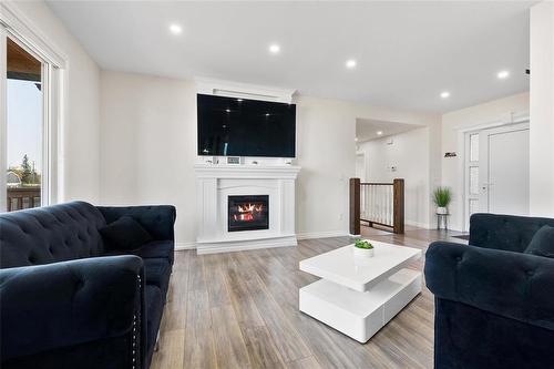 1 Arthur Fiola Place, Ste Anne, MB - Indoor Photo Showing Living Room With Fireplace