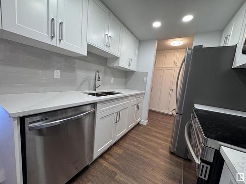 #103 10511 19 Av Nw, Edmonton, AB - Indoor Photo Showing Kitchen With Double Sink