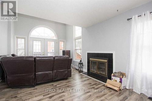 D-17 - 1663 Nash Road, Clarington, ON - Indoor Photo Showing Living Room With Fireplace