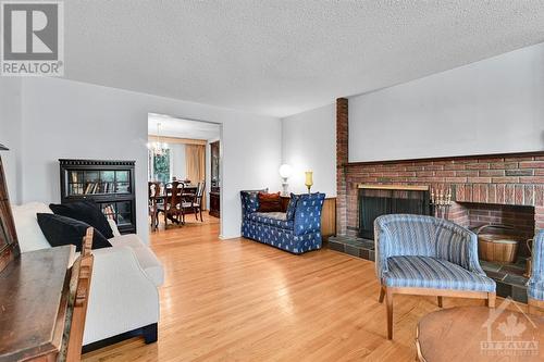 34 Farlane Boulevard, Ottawa, ON - Indoor Photo Showing Living Room With Fireplace