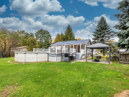 Face arriÃ¨re - 235 35E Rue O., Venise-En-Québec, QC - Outdoor With Above Ground Pool With Backyard