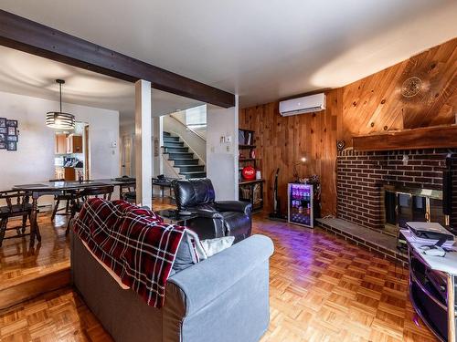 Living room - 6770 Av. Tisserand, Brossard, QC - Indoor With Fireplace