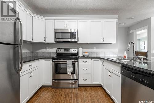 323 125 Willis Crescent, Saskatoon, SK - Indoor Photo Showing Kitchen With Stainless Steel Kitchen With Double Sink