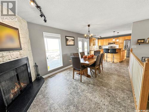 Nw City Limit Acreage, Swift Current Rm No. 137, SK - Indoor Photo Showing Dining Room With Fireplace