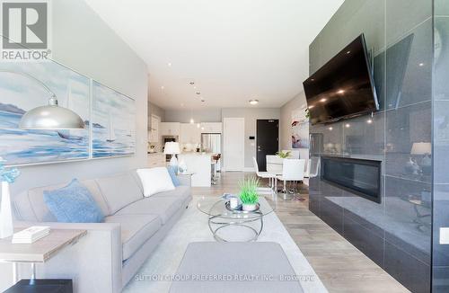 102 - 1705 Fiddlehead Place, London, ON - Indoor Photo Showing Living Room With Fireplace