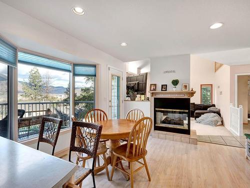 4986 Uplands Drive, Kamloops, BC - Indoor Photo Showing Dining Room With Fireplace