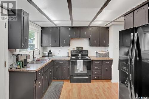 203 Church Drive, Regina, SK - Indoor Photo Showing Kitchen With Double Sink