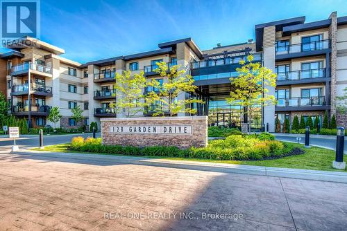 222 - 128 Garden Drive, Oakville, ON - Outdoor With Balcony With Facade