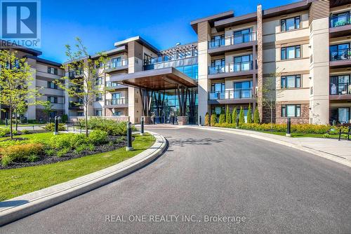 222 - 128 Garden Drive, Oakville, ON - Outdoor With Balcony With Facade