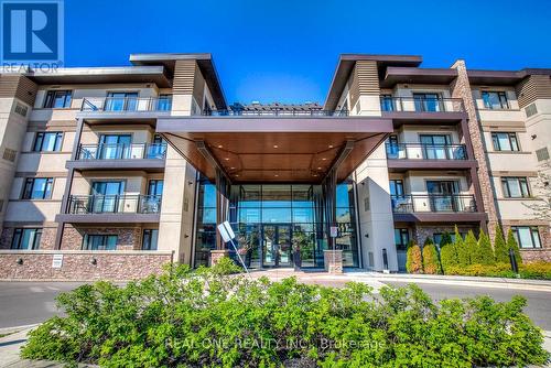 222 - 128 Garden Drive, Oakville, ON - Outdoor With Balcony With Facade