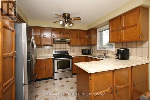 23 John Lindsay Court, Toronto, ON - Indoor Photo Showing Kitchen With Double Sink