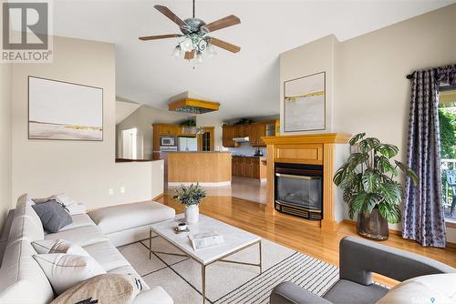 76 St Andrews Bay, Emerald Park, SK - Indoor Photo Showing Living Room With Fireplace