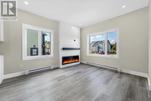 35 Markham Drive, St. Philips, NL - Indoor Photo Showing Living Room With Fireplace