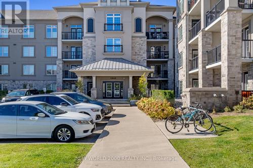 307 - 1440 Main Street E, Milton, ON - Outdoor With Balcony With Facade