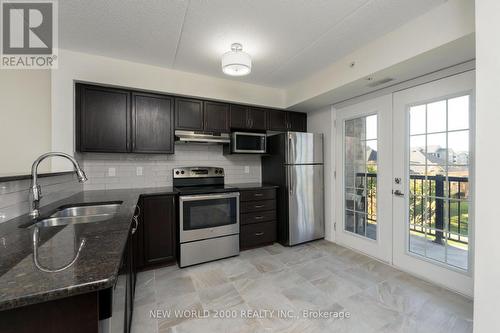 307 - 1440 Main Street E, Milton, ON - Indoor Photo Showing Kitchen With Stainless Steel Kitchen With Double Sink With Upgraded Kitchen