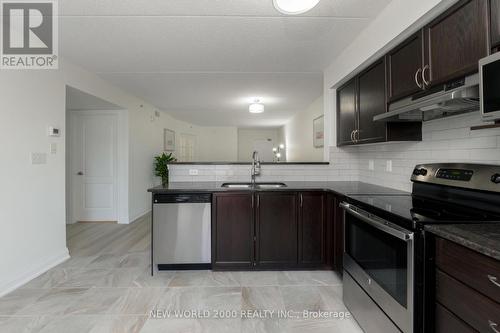 307 - 1440 Main Street E, Milton, ON - Indoor Photo Showing Kitchen With Stainless Steel Kitchen With Upgraded Kitchen