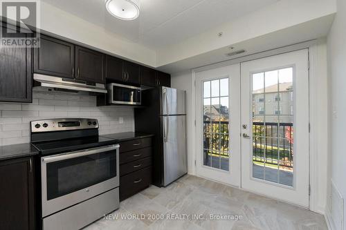 307 - 1440 Main Street E, Milton, ON - Indoor Photo Showing Kitchen With Stainless Steel Kitchen With Upgraded Kitchen